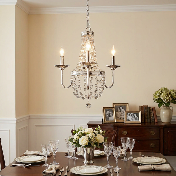 Feiss Malia 3-light polished nickel chandelier with crystal beads hanging over an elegant dining room table.