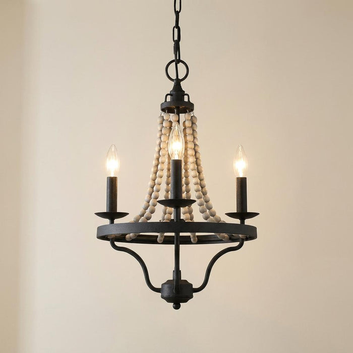 Three-light chandelier featuring a dark zinc frame and draped light wood beads against a beige background.