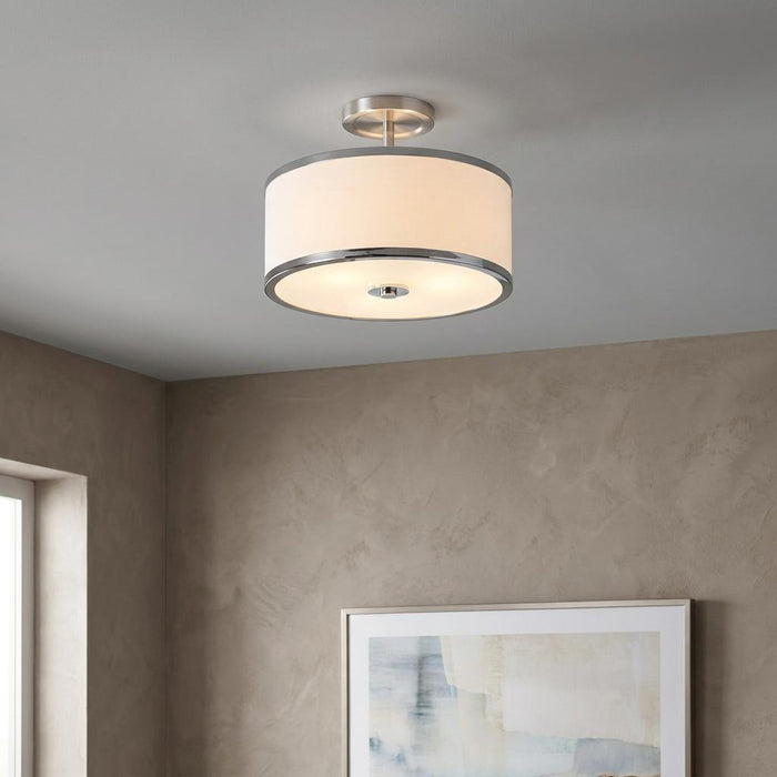 Feiss Prospect Park semi-flush ceiling light with chrome accents and white drum shade in a neutral toned room.