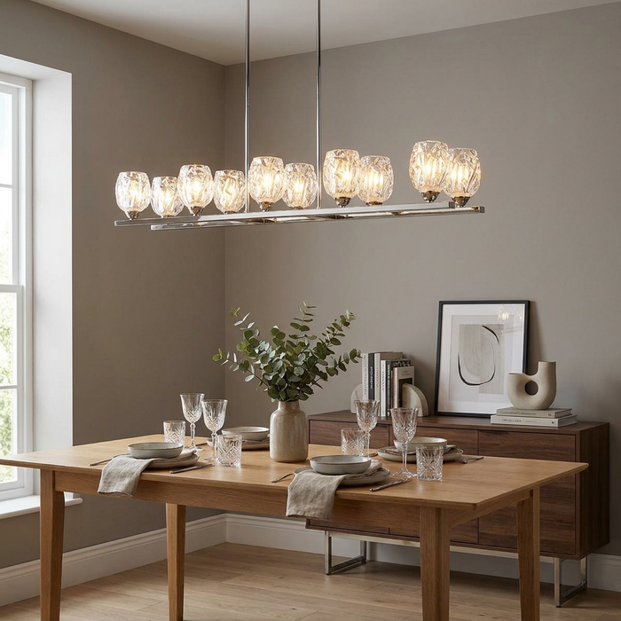 Feiss Rubin 10-light island chandelier with textured glass shades over a modern wooden dining table setting.
