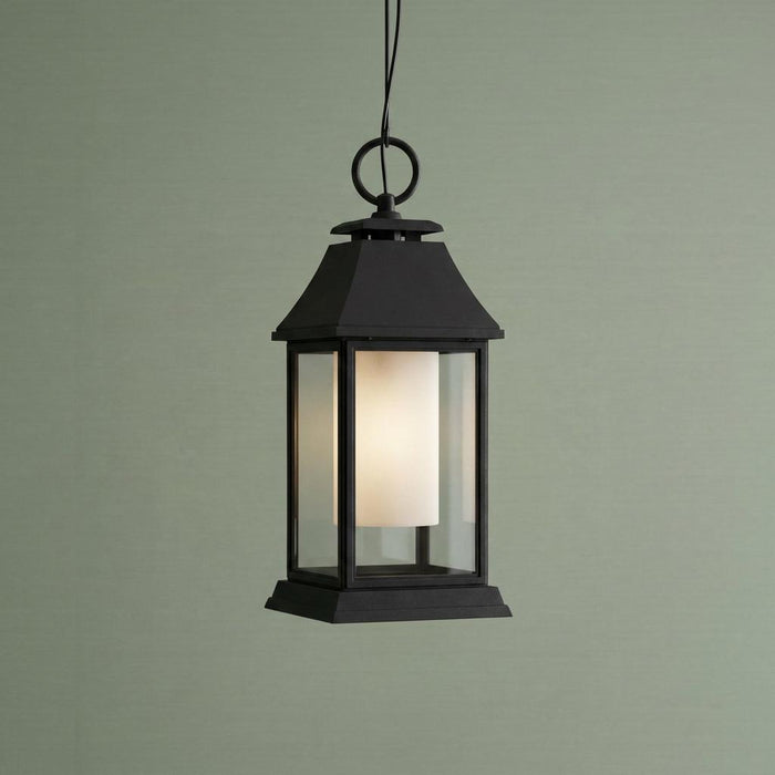 Classic black outdoor lantern pendant featuring clear outer glass and a frosted white inner diffuser.