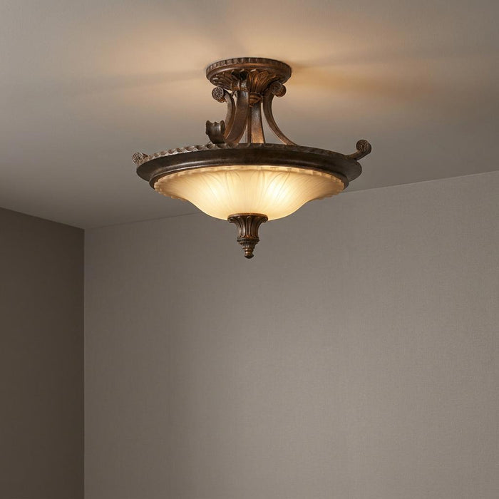 Feiss Stirling Castle semi-flush ceiling light with bronze metalwork and an excavated glass shade.