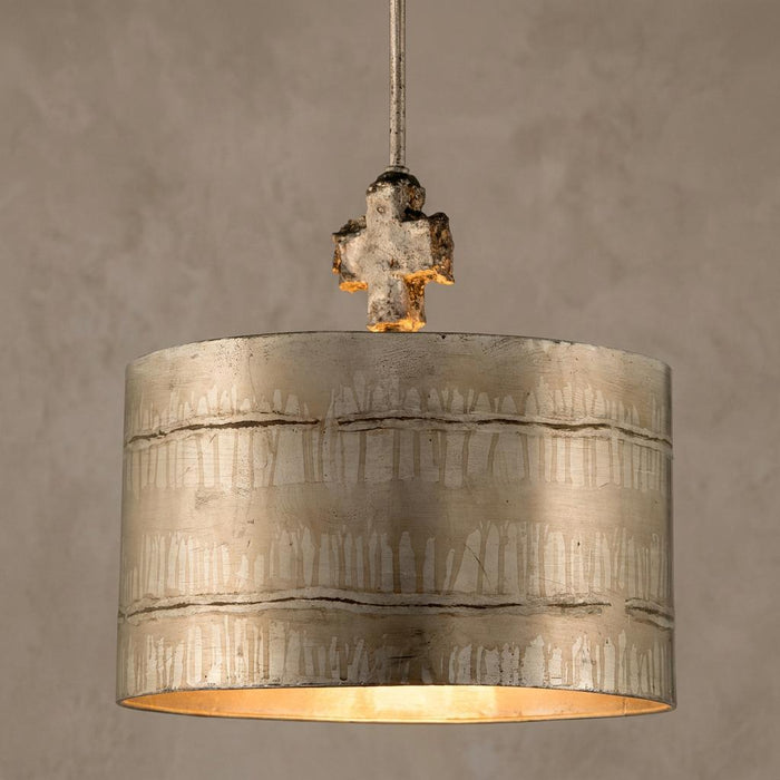Large silver pendant light with an etched drum shade and a distressed cross detail at the top.