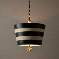 Flambeau South Beach pendant light with black and cream striped drum shade and a gold leaf finial.