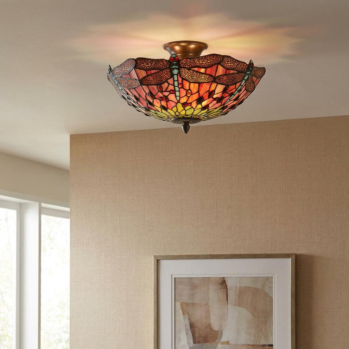 Flame Dragonfly semi-flush Tiffany ceiling light with a stained-glass dragonfly design mounted on a white ceiling.