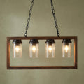 Four-light rectangular wood frame ceiling pendant with seeded glass shades hanging from black chains.