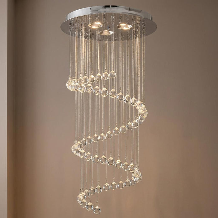 Chrome ceiling light featuring a spiral cascade of sparkling crystal spheres illuminated from above.