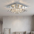 Hanna 4 light square chrome flush ceiling light with cascading crystal pyramid drops in a modern living room.