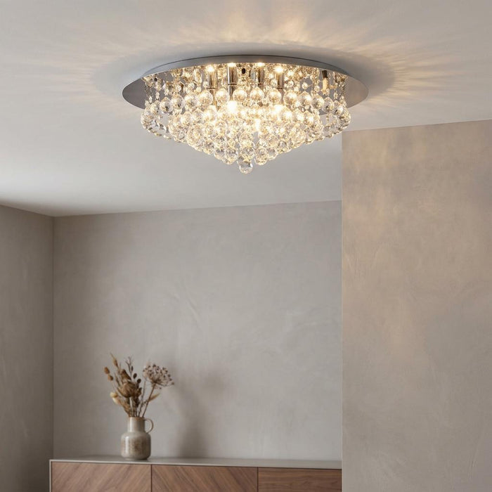 Hanna 8-light chrome and crystal ball flush ceiling light illuminating a neutral living space.