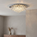Hanna 8-light chrome and crystal ball flush ceiling light illuminating a neutral living space.