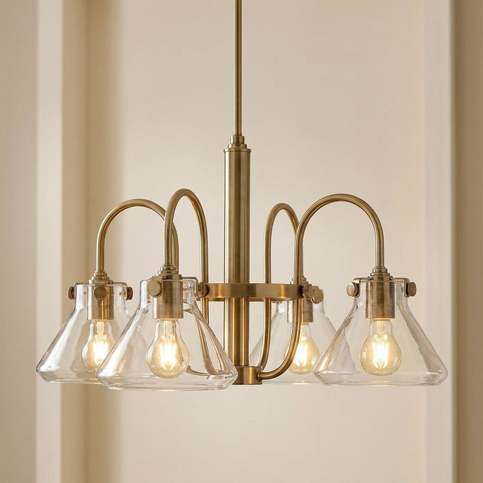 Hinkley Congress chandelier in brushed caramel featuring four clear glass conical shades and curved arms.