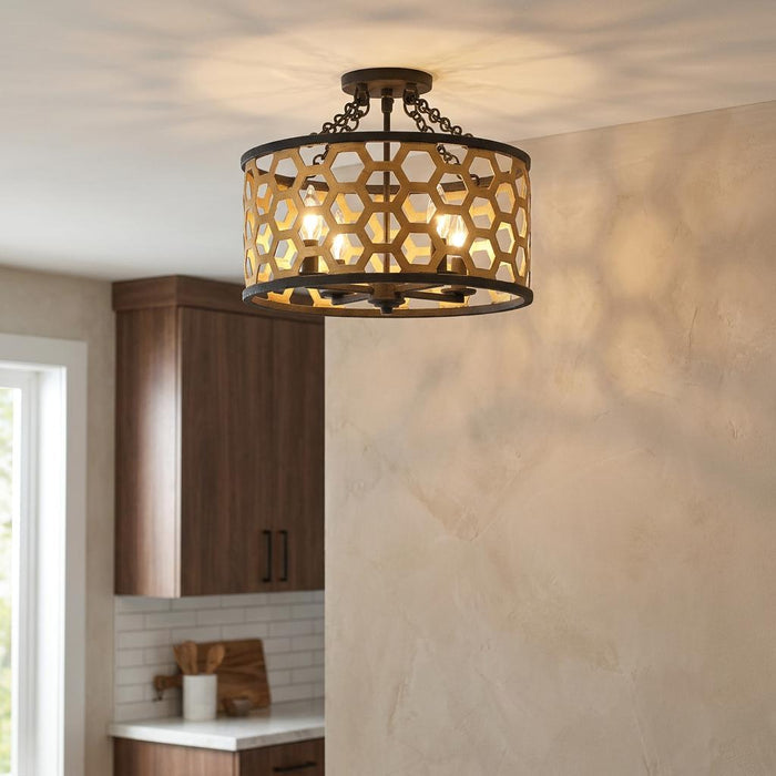 Hinkley Felix 4-light semi-flush ceiling mount with gold honeycomb shade casting patterned shadows in a kitchen.