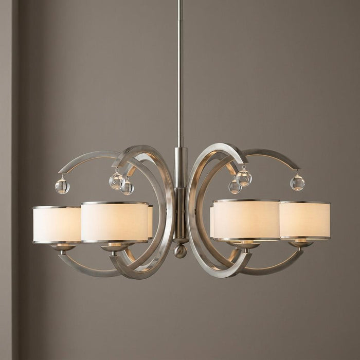Brushed nickel 6-light chandelier featuring arched arms, white fabric drum shades, and crystal sphere accents.