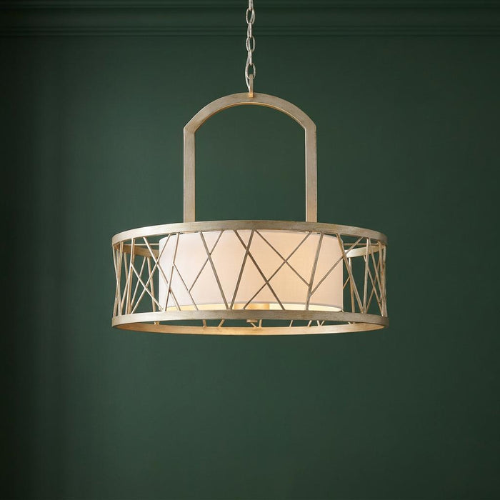 A Hinkley Nest Pendant with a silver leaf lattice frame and white fabric drum shade against a green wall.