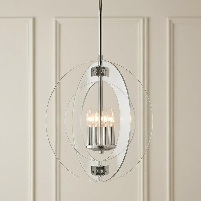 Hinkley Solstice 4-light pendant chandelier with polished chrome and clear rings against a paneled wall.
