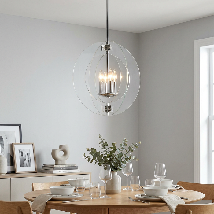 Polished chrome four-light orb chandelier with glass rings hanging over a minimalist dining table.