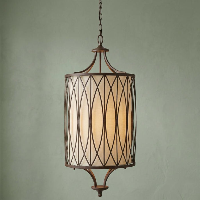 Victorian Bronze pendant light with a geometric lattice metal cage and a warm cream fabric drum shade.