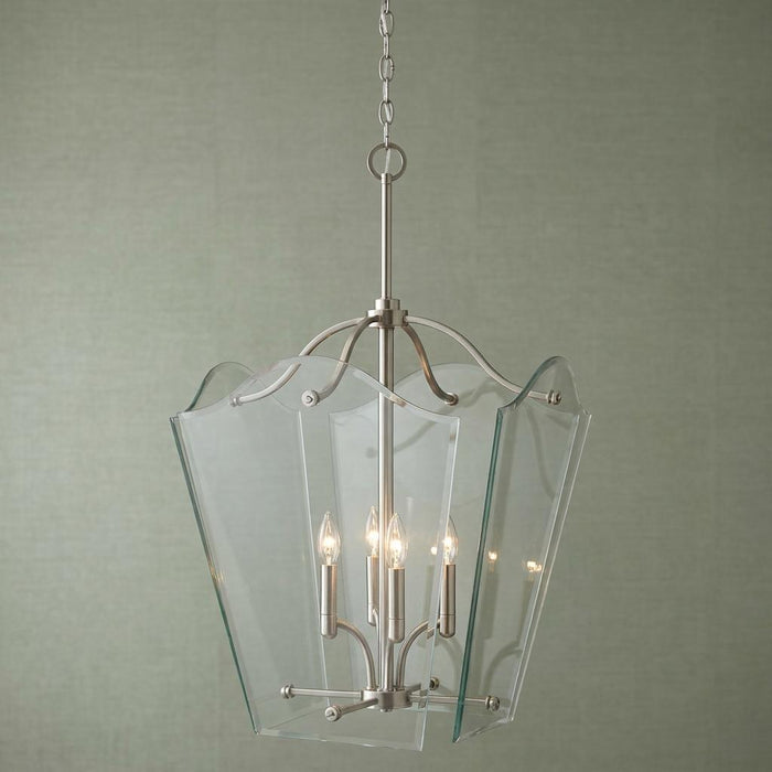 Six-light nickel ceiling lantern with scalloped clear glass panels suspended against a pale green wall.