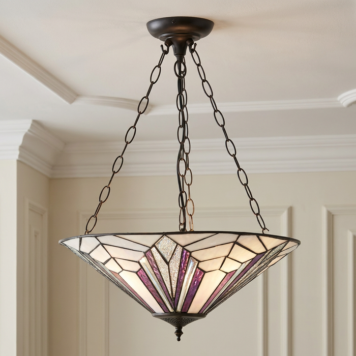 Inverted Tiffany ceiling light with an Art Deco purple and white glass pattern suspended by black chains.