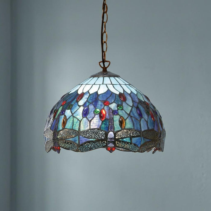 Interiors 1900 Blue Dragonfly Small Tiffany ceiling light with a stained glass shade hanging against a plain wall.