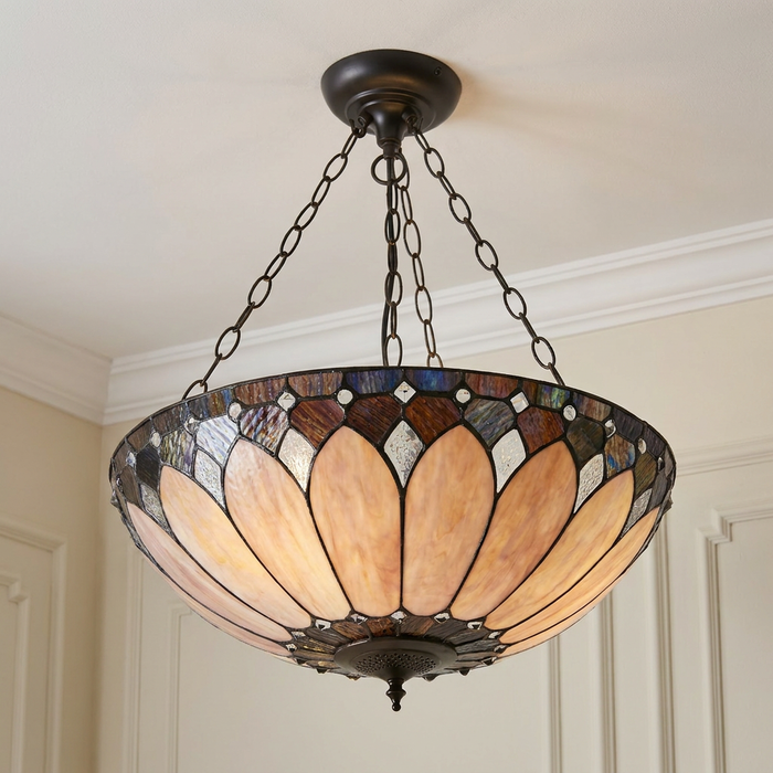 Inverted Tiffany ceiling light featuring an amber stained glass petal pattern and dark bronze hardware.