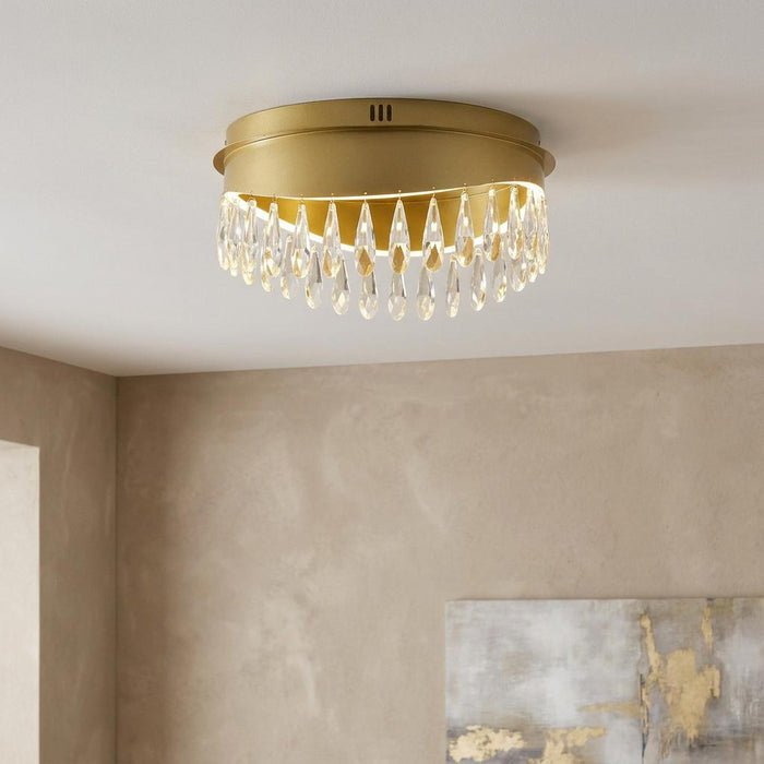 Jewel LED gold flush ceiling light with crystal droplets mounted on a white ceiling.