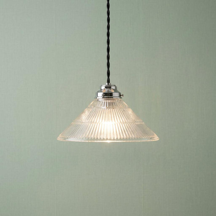 A conical prismatic glass pendant light with a chrome fitting and black twisted cord against a pale green wall.