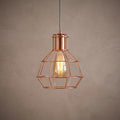 Copper caged single ceiling pendant light with a filament bulb against a grey textured background.