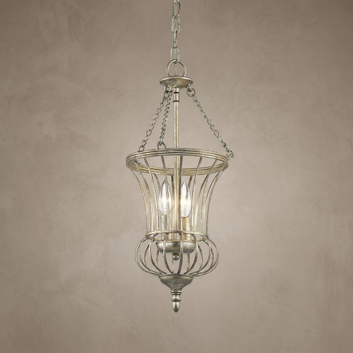 Small gold pendant ceiling light featuring a curved metal wire cage and two glowing candelabra bulbs.