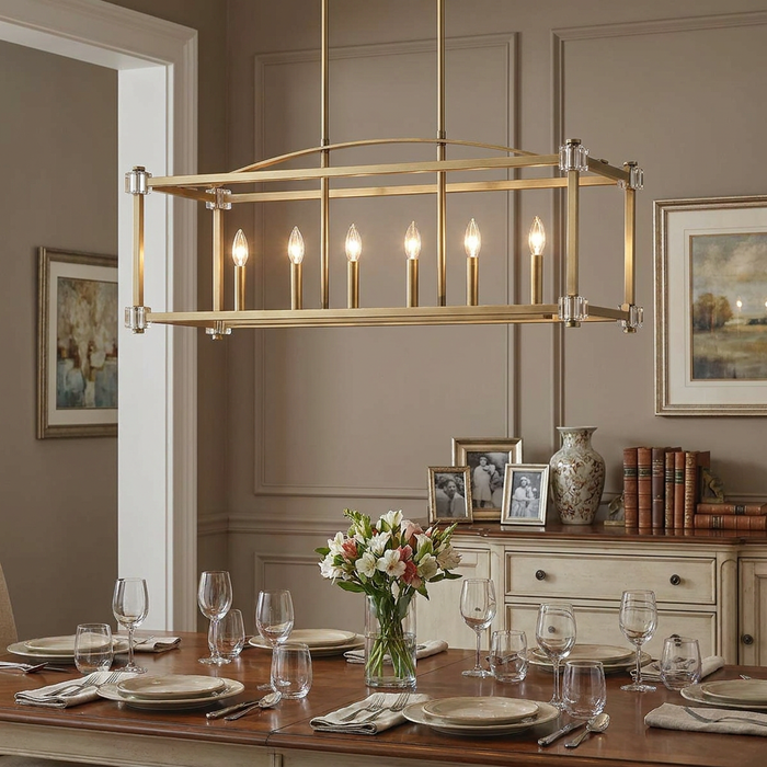 Six-light brass linear chandelier with candle bulbs over an elegantly set dining table in a neutral-toned room.
