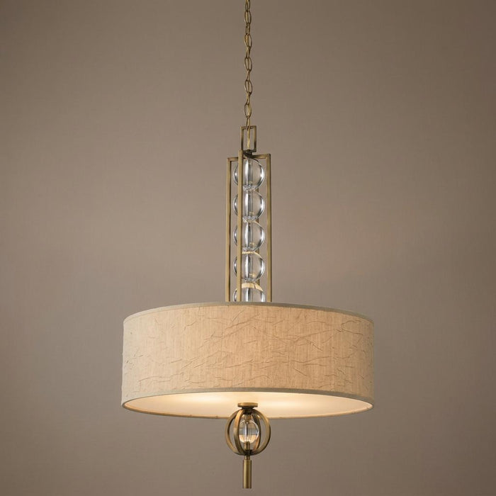 Kichler Celestial pendant light featuring a textured tan drum shade and decorative vertical glass spheres.