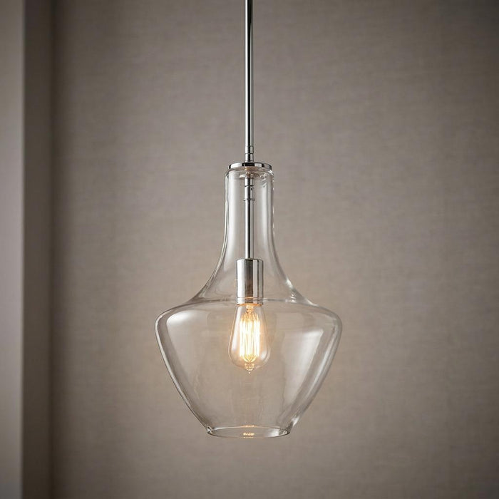 Kichler Everly chrome pendant light with a clear teardrop glass shade and a warm glowing Edison bulb.