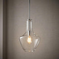 Kichler Everly chrome pendant light with a clear teardrop glass shade and a warm glowing Edison bulb.