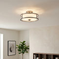 Kichler Lacey 3-light semi-flush ceiling light in antique pewter with a white fabric shade and clear glass wrap.