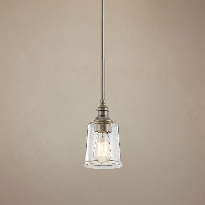 Classic pewter mini ceiling pendant with a seeded glass shade and illuminated Edison bulb.