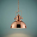 Louisiana Industrial 1 Light Copper Pendant Searchlight with a polished dome shade against a teal background.