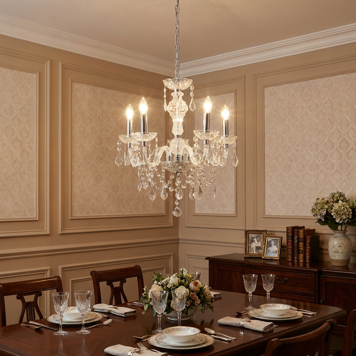 Marie Therese 5-light acrylic chandelier with crystal droplets hanging in a formal, paneled dining room.