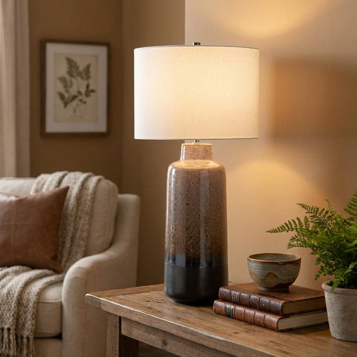 Maryland Brown & Graphite Ceramic Table Lamp with a gradient base and white shade on a wooden living room side table.
