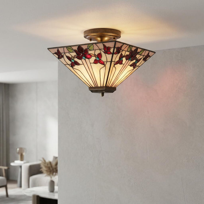 Oaks Lighting Camillo Tiffany semi-flush ceiling light with a red floral stained glass shade in a modern room.