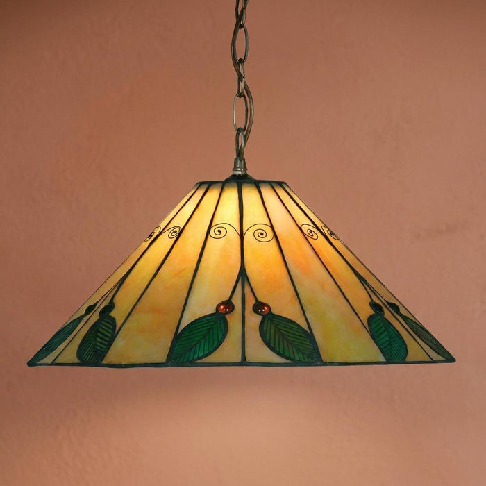 Tiffany-style pendant light with an amber stained glass shade featuring green leaf motifs and a chain suspension.
