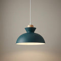 Modern slate grey dome pendant light with a wooden detail and white cord against a plain wall.