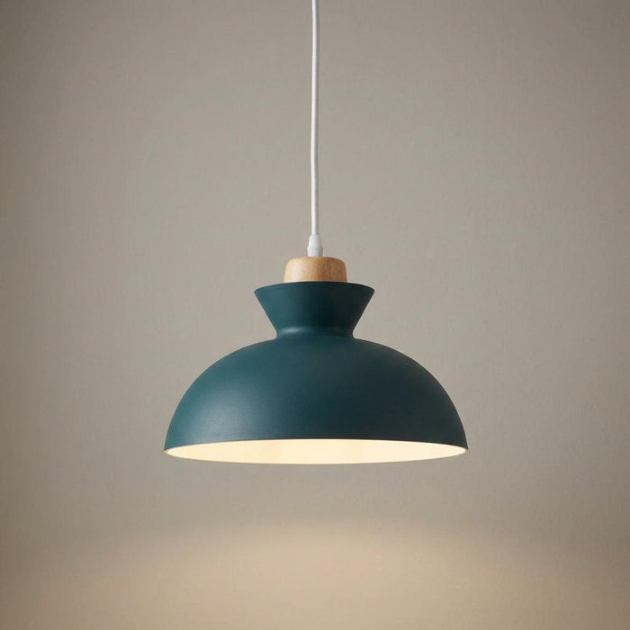 Modern slate grey dome pendant light with a wooden detail and white cord against a plain wall.