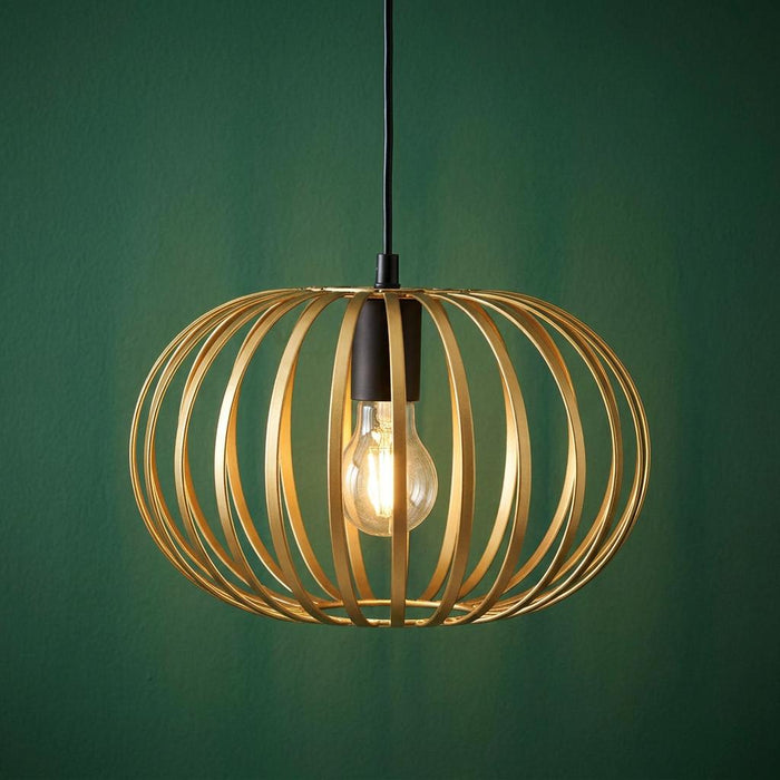 Oaks Lighting Salta gold cage pendant light with an internal bulb against a dark green wall.