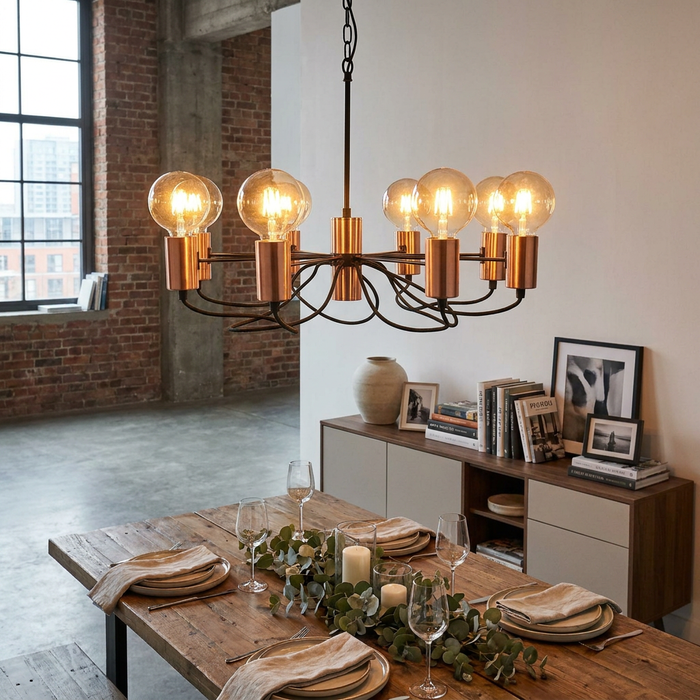 Oaks Lighting Tala 8 Light Matt Copper Chandelier with large bulbs hangs over a set wooden dining table in a loft.