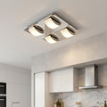 Oaks Lighting Torva 4-light chrome LED ceiling fixture with curved glass shades in a modern kitchen.