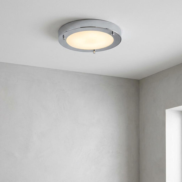 Oaks Rondo small flush chrome bathroom ceiling light with frosted glass diffuser mounted on a plain white ceiling.