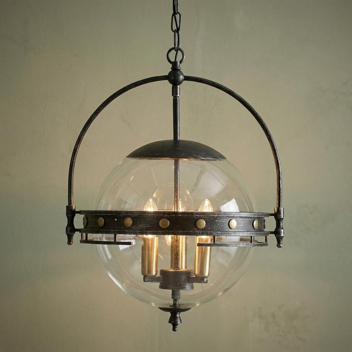 Oaks Tromso 3-light ceiling lantern featuring a clear glass globe and a dark metal arch frame with gold-studded accents.