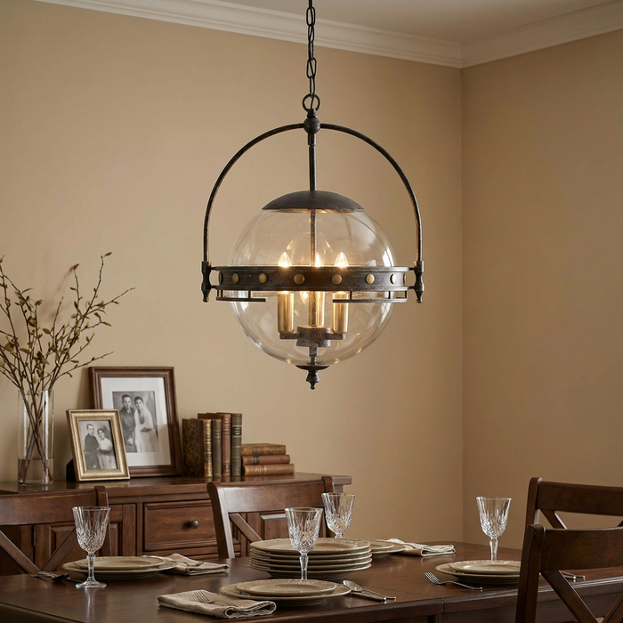 Oaks Tromso 3-light globe lantern with dark metal frame hanging over an elegantly set dining table.