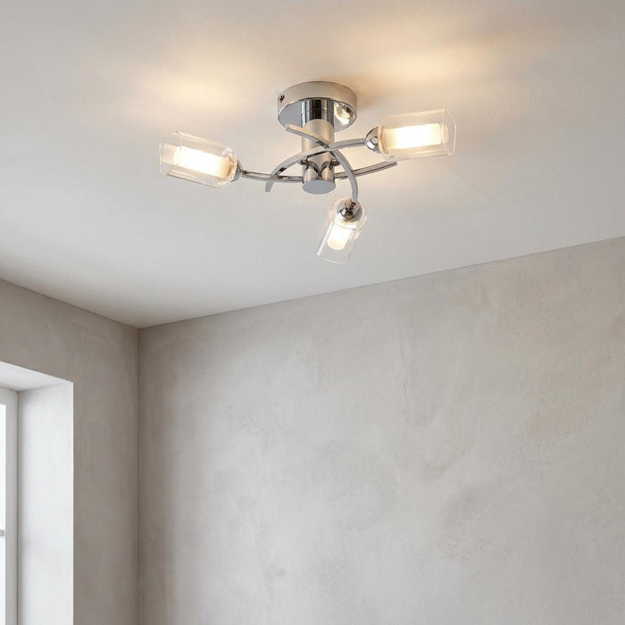Ofira 3 Light Chrome Flush Ceiling Light with three cylindrical glass shades on a white ceiling.
