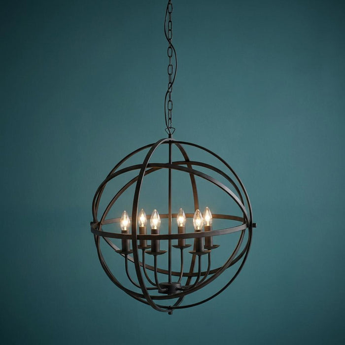 Black six-light orb cage pendant with glowing candle-style bulbs against a teal background.